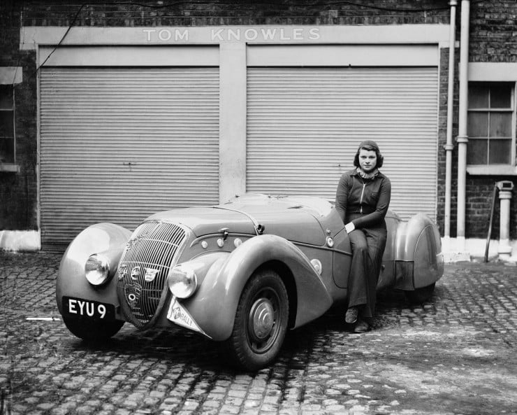 Miss-Patten-Baroness-Dorndorf-sits-on-the-door-of-her-Peugeot-outside-Tom-Knowles-garage-May-1939