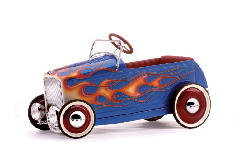 red metal pedal car