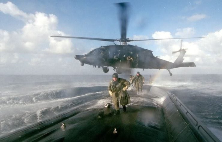 U.S. Army MH-60L Blackhawk from the 160th SOAR deploys an ODA from 7th SFG(A) onboard a U.S. submarine