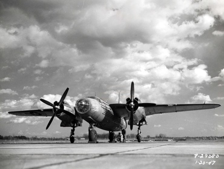 A low-angle view of the XB-26H Marauder and its experimental bicycle landing gear.