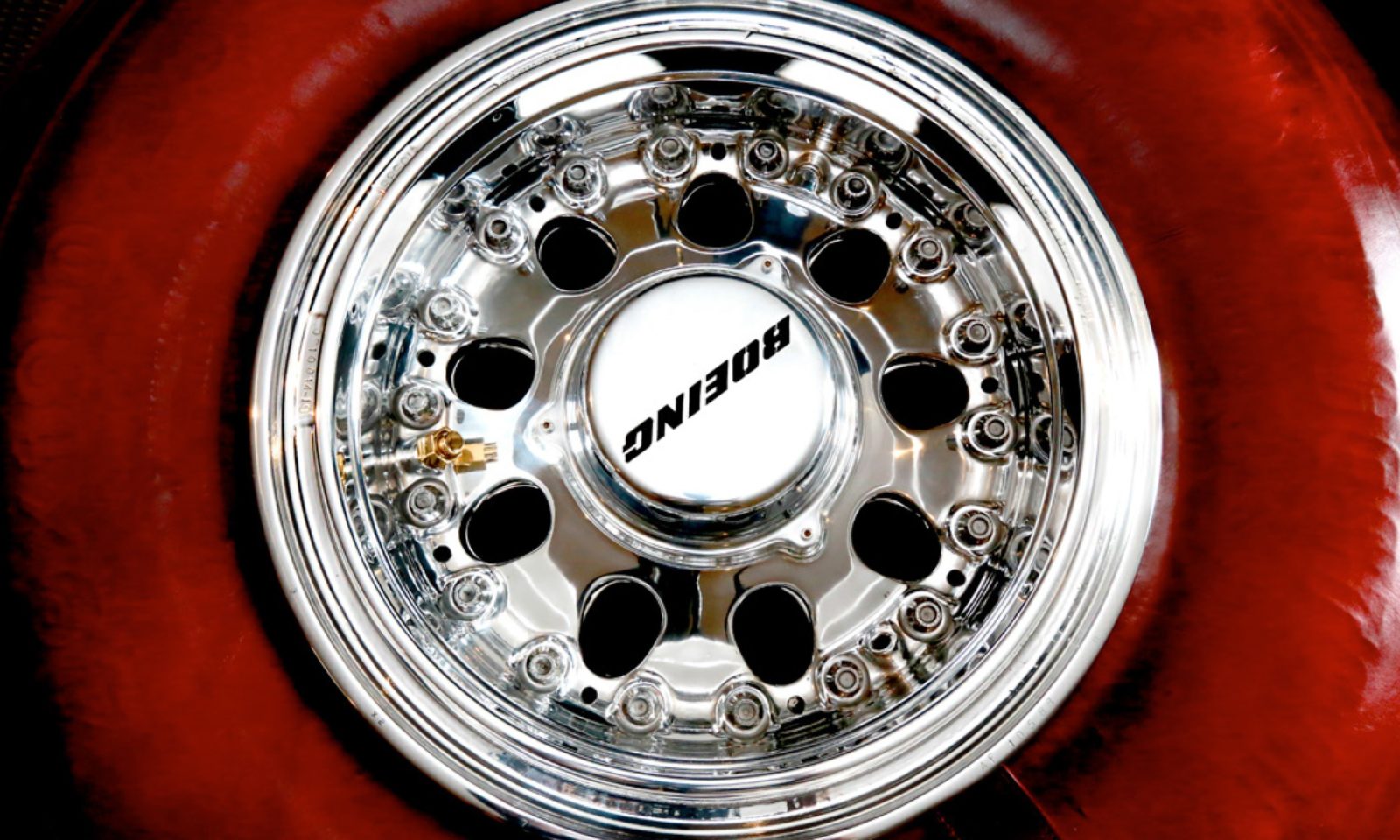 747 Rim Boeing 747 Wheel + Tire Coffee Table by Plane Industries