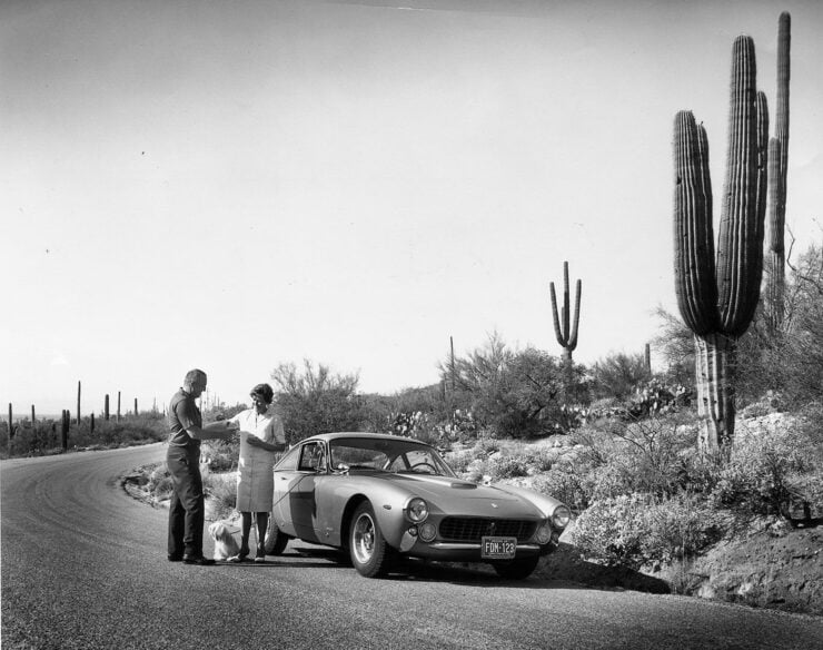 A Ferrari 250 GT Lusso parked by the side of the road for a coffee break